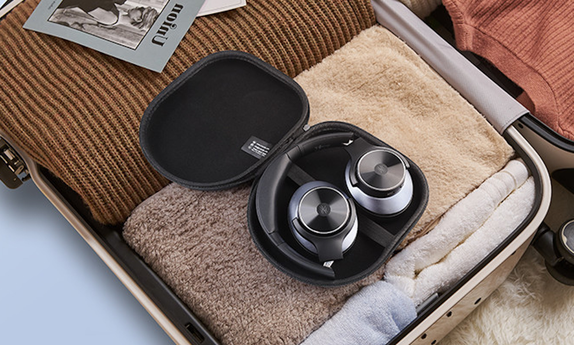 OneOdio A10 headphones in use on a commuter train showing noise cancellation